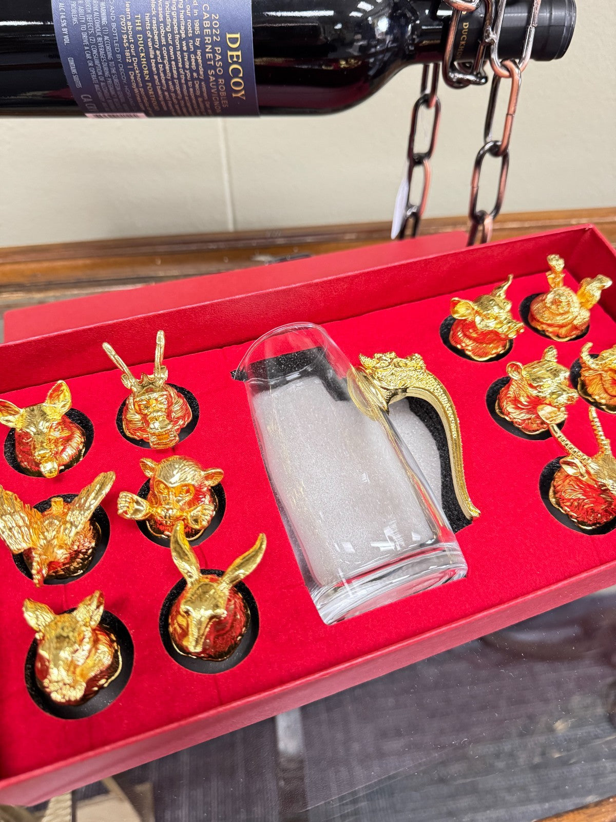 Zodiac Wine Set – 12 Gold Animal Shot Glasses & Glass Decanter with Dragon Handl