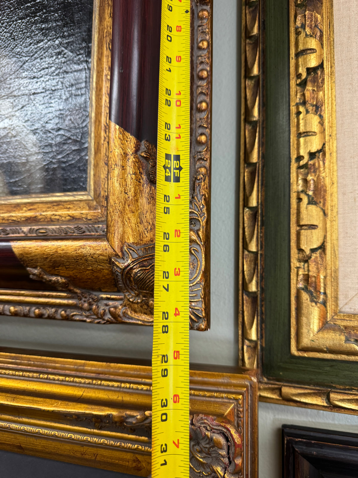 Tape measure showing the framed height of about 28 inches