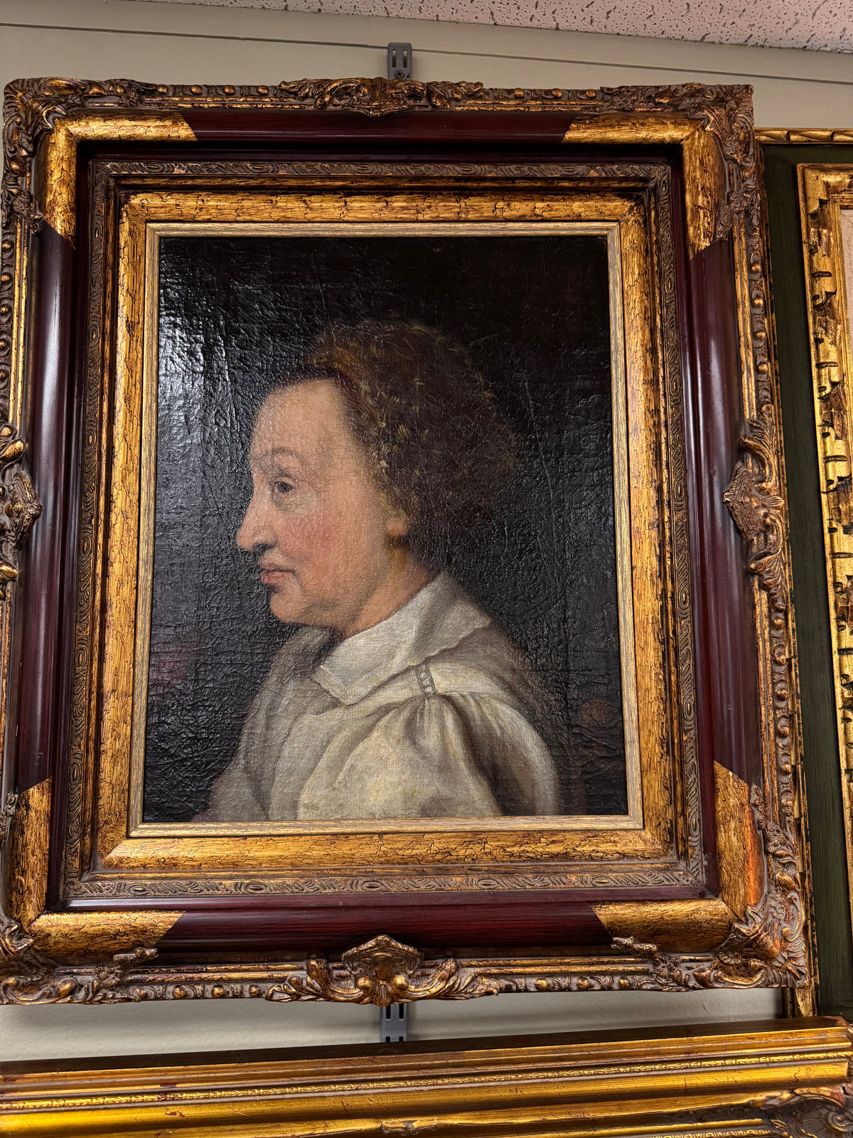 Front view of the antique profile portrait oil on canvas in gold frame