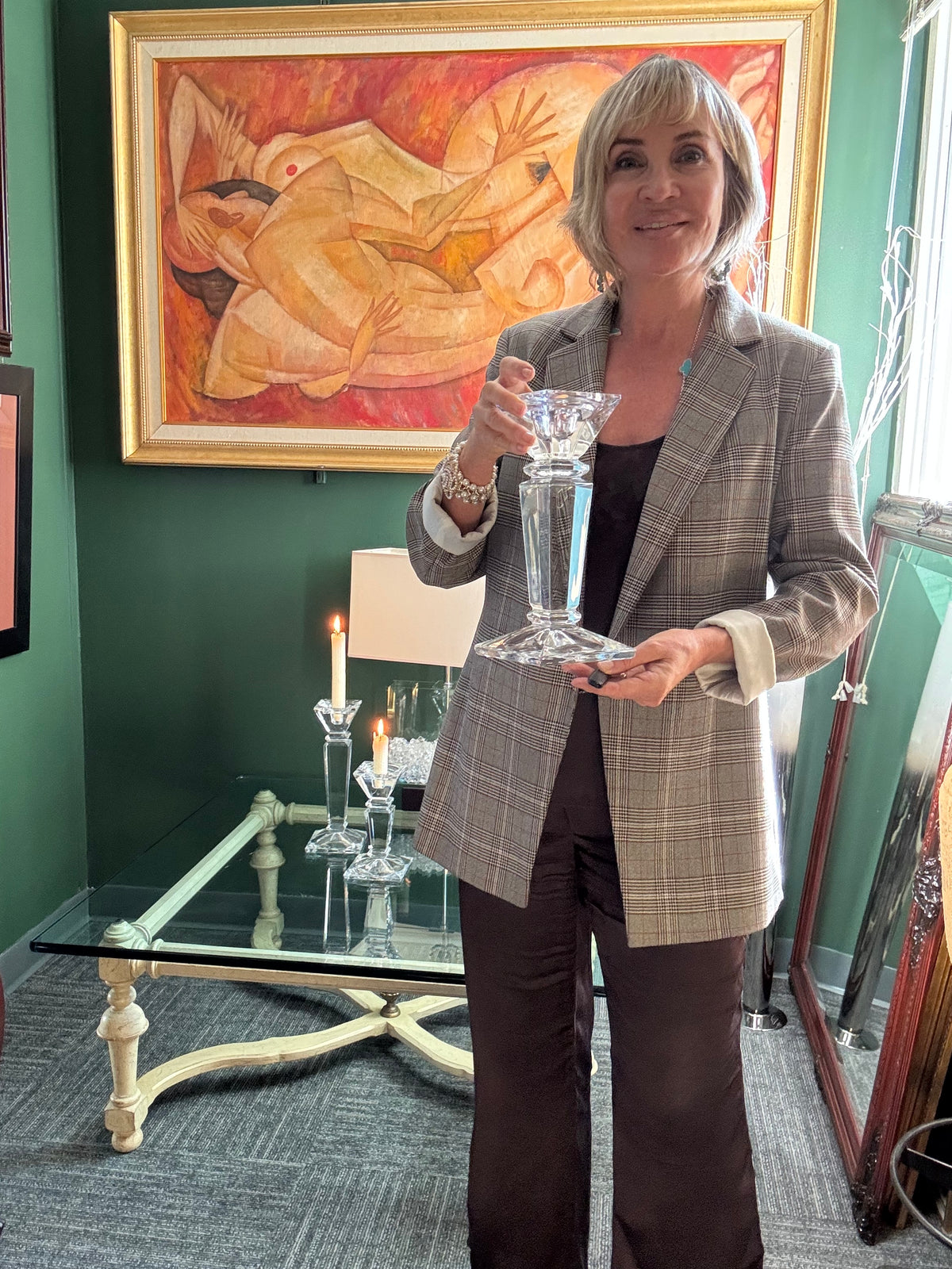 Tall Shannon Crystal candle holder held in hand to show scale